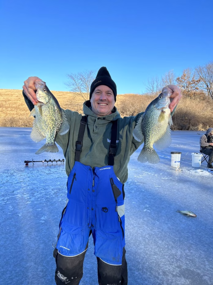 Ice-fisherman-with-crappies-Iowa-DNR-photo-980x1307